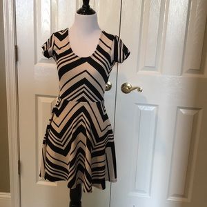 Tan and black scoop-neck dress.